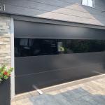 Used – 1 – 16x8 black Sterling contemporary door. Solid panels only.